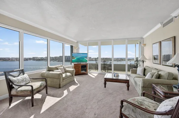a living room with furniture and a large window