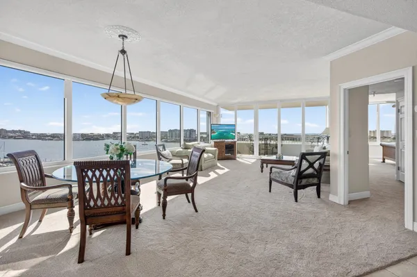 a view of a dining room with furniture window and outside view