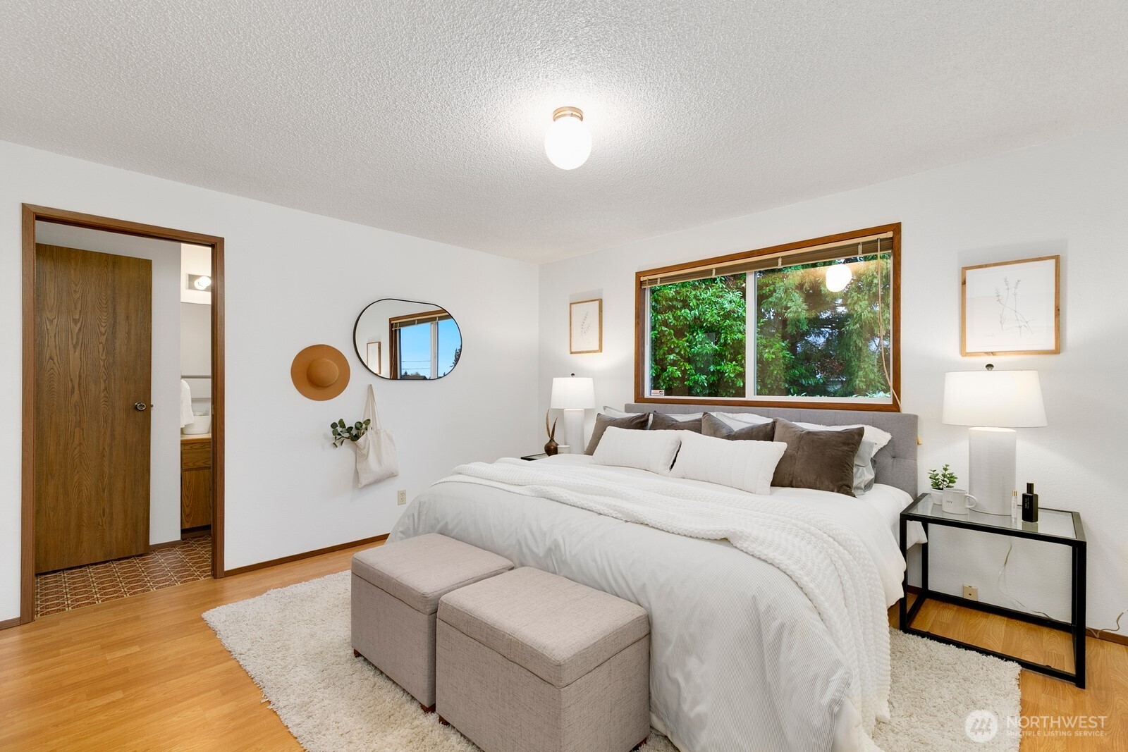 12903 Southeast 160th Street Renton, WA 98058 - Photo 16 of 24 a bedroom with a bed and a window