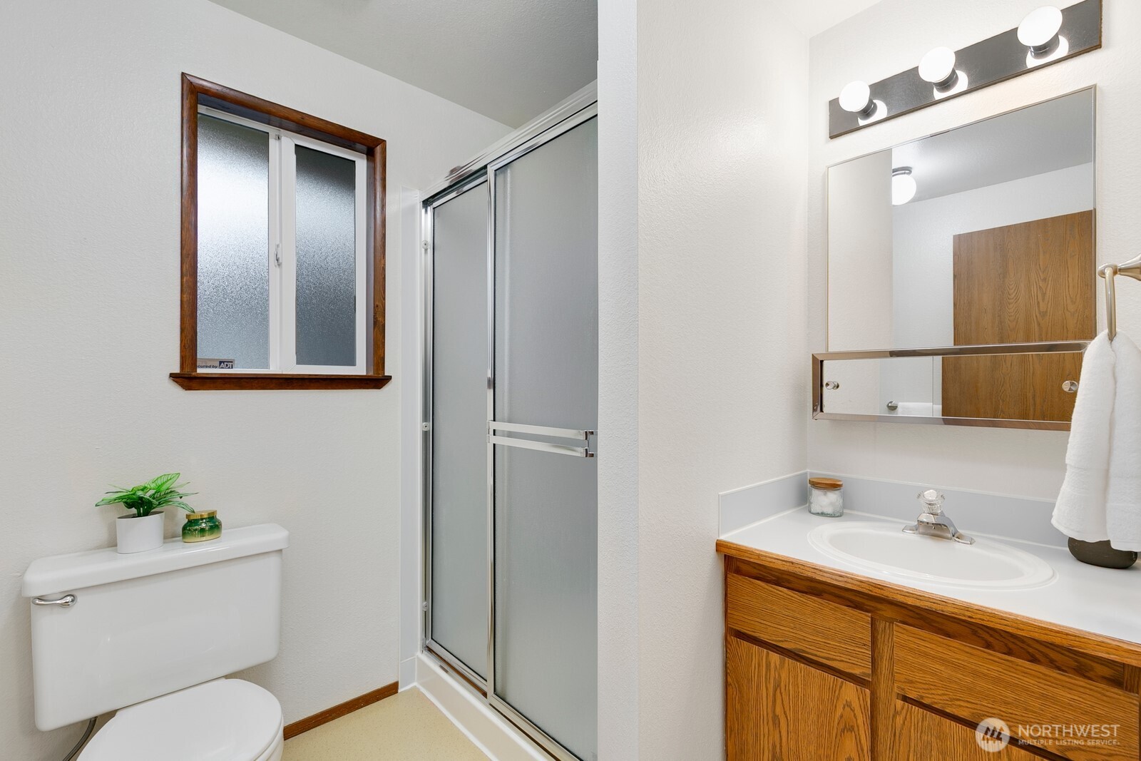 12903 Southeast 160th Street Renton, WA 98058 - Photo 20 of 24 a bathroom with a granite countertop sink toilet and shower
