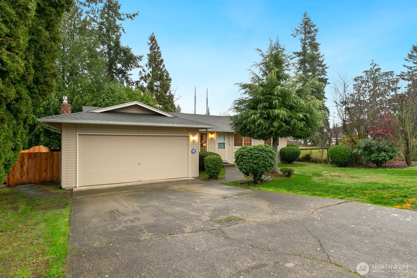 12903 Southeast 160th Street Renton, WA 98058 - Photo 23 of 24 a front view of a house with a yard and garage