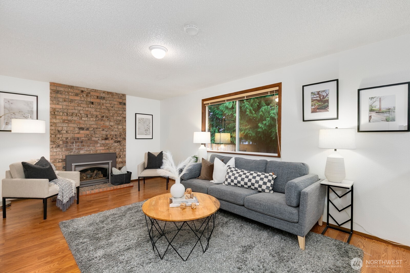 12903 Southeast 160th Street Renton, WA 98058 - Photo 7 of 24 a living room with furniture and a fireplace