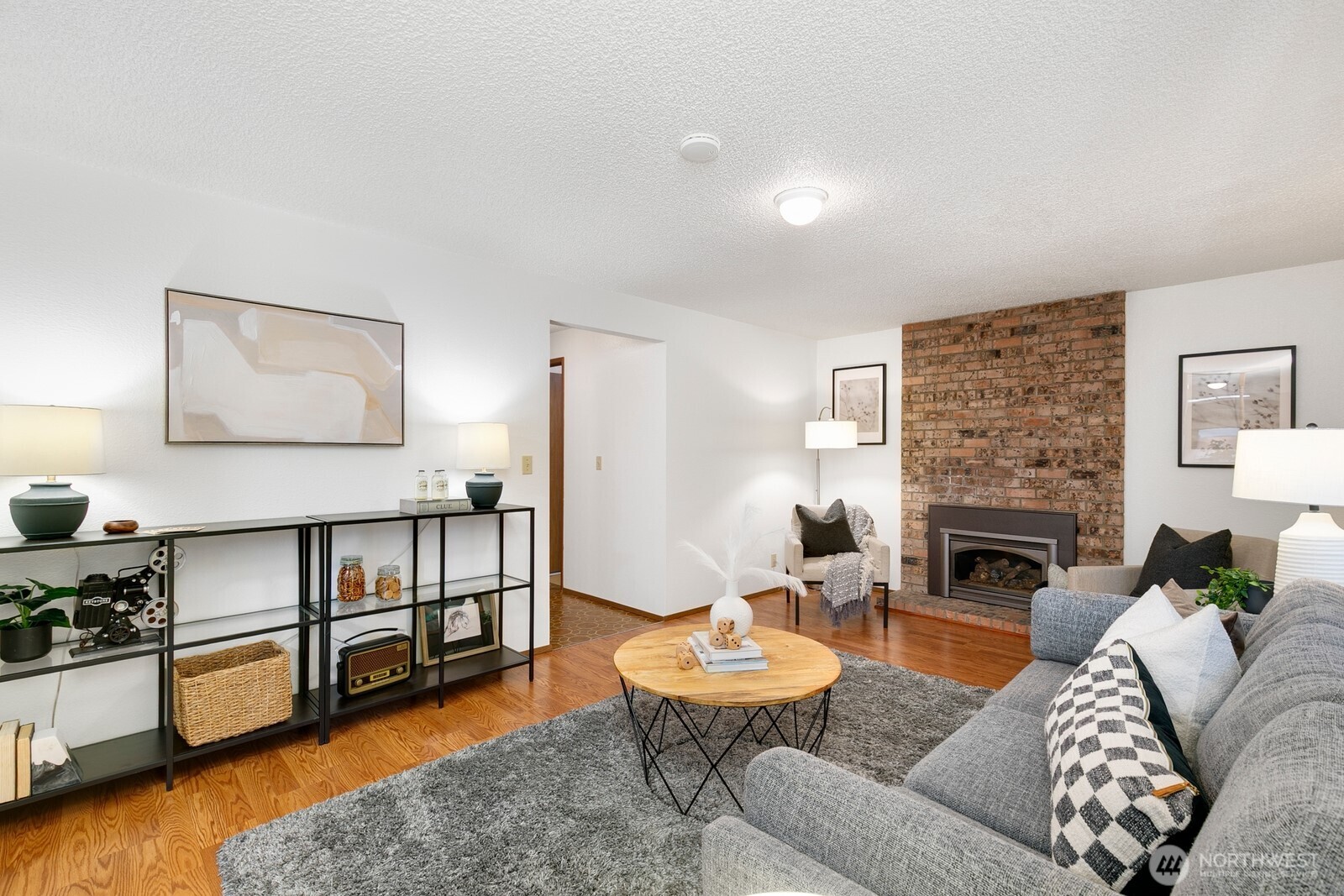 12903 Southeast 160th Street Renton, WA 98058 - Photo 8 of 24 a living room with furniture and a wooden floor