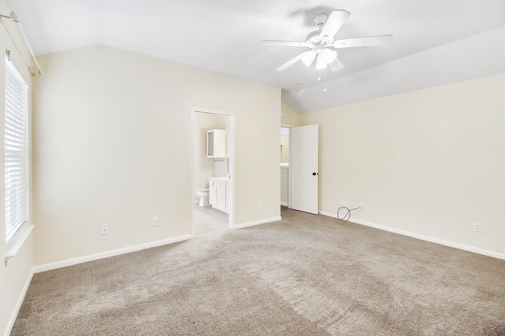 1814 Parkfair Court Katy, TX 77450 - Photo 23 of 36 Another view of the Master Suite offering nice covered finished windows and a ceiling fan.