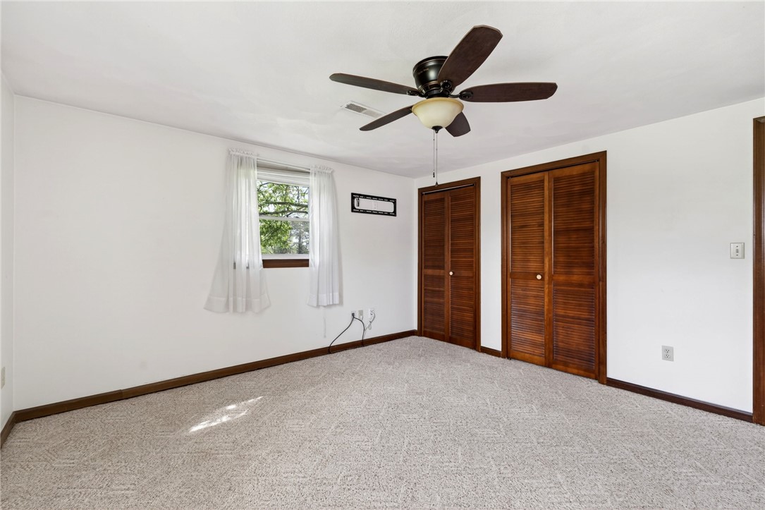 7988 McCool Road Greenville, OH 45331 - Photo 21 of 50 This bright and airy bedroom offers a comfortable retreat with ample storage and gentle illumination.