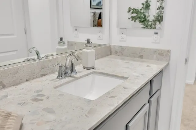 a bedroom with a large bed and a couch