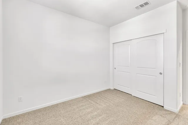 a spacious bathroom with a granite countertop tub sink a mirror a shower and vanity