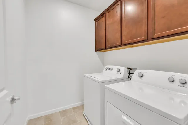a bathroom with a granite countertop sink mirror and a bathtub