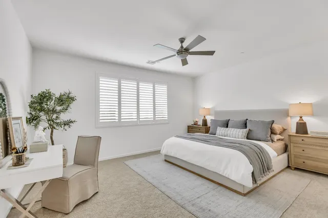 a white bath tub sitting next to a white sink