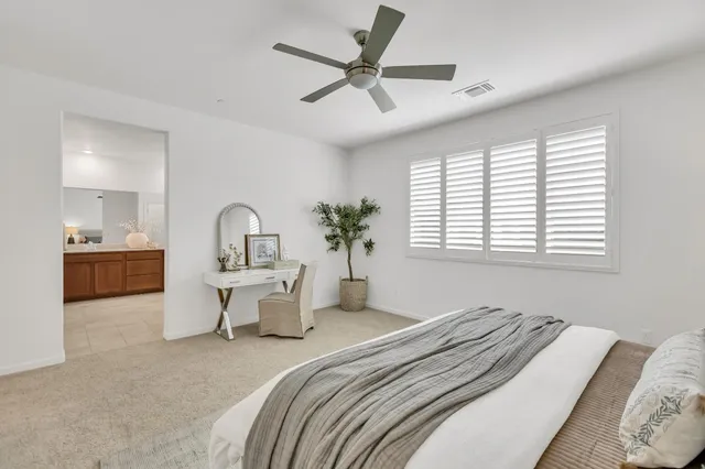 a bathroom with a granite countertop sink a large mirror and a window