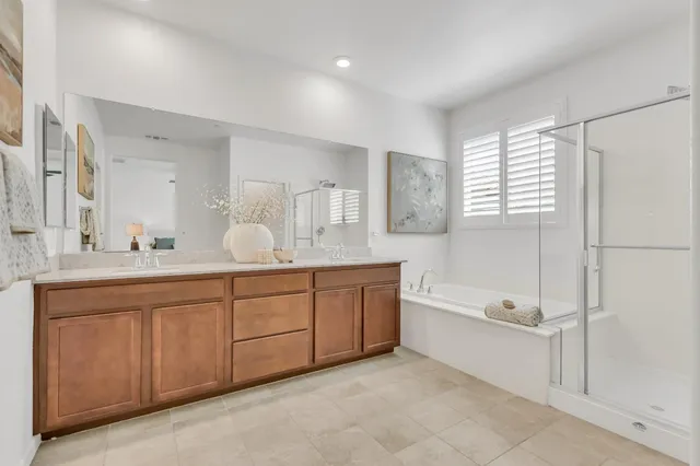a view of a porch with furniture and garden