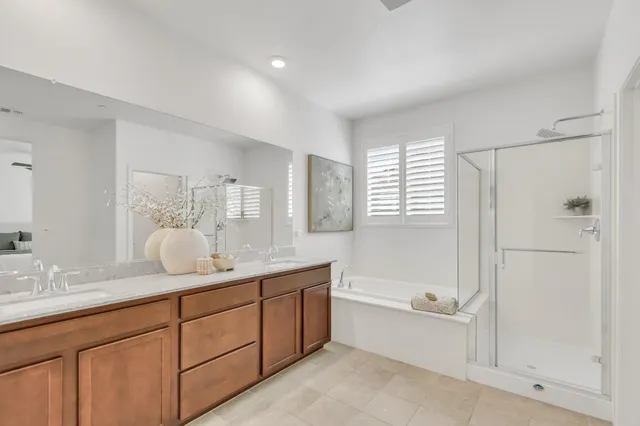 a view of a house with swimming pool and sitting area