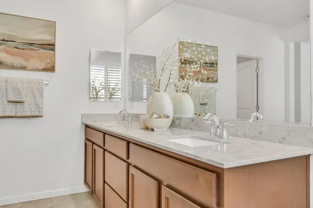 an aerial view of a house with a swimming pool and garden