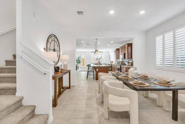 a living room with fireplace furniture and a window