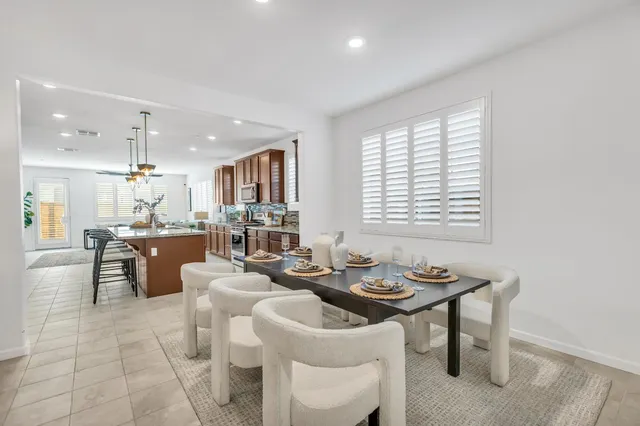 a very nice looking dining room with furniture