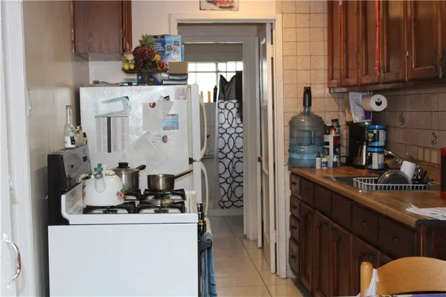 a kitchen with cabinets and window