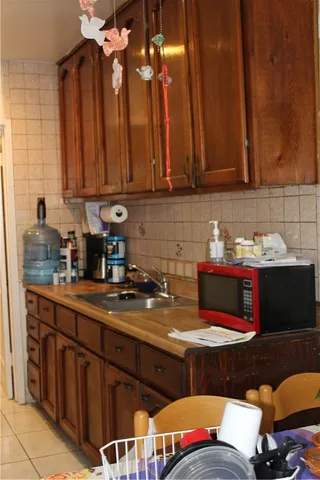 a kitchen with a sink and cabinets