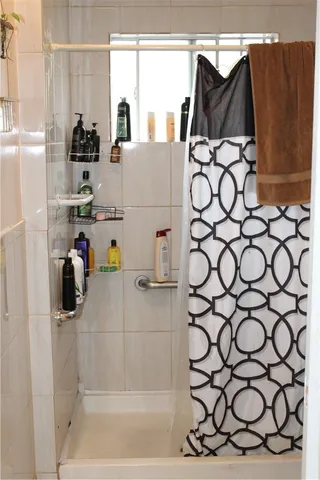 a bathroom with a sink and a shower curtain