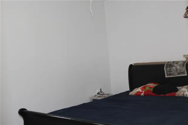 a blue sign that is on a brick wall