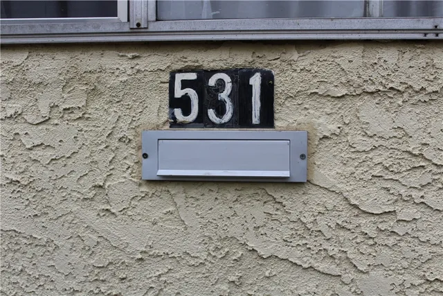 a sign that is sitting in the middle of a park