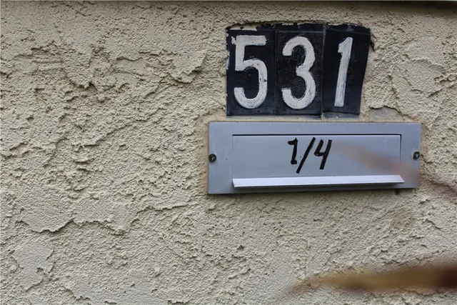 a kitchen with a sink a stove and a microwave