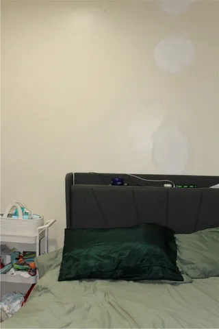 a view of a hallway with wooden floor and closet