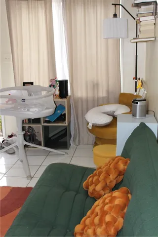 a bedroom with a bed and a television