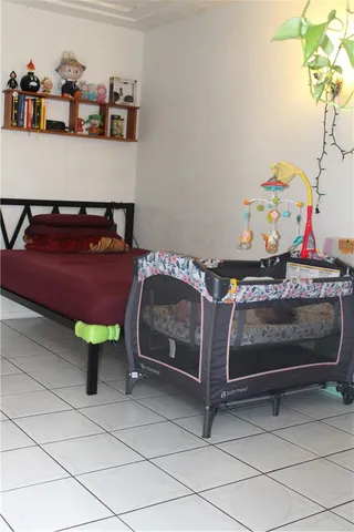 a bedroom with a bed and a table in it