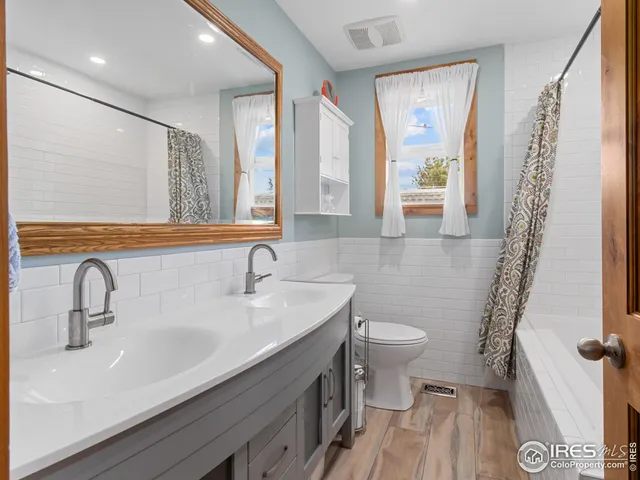 a backyard of a house with garden and plants