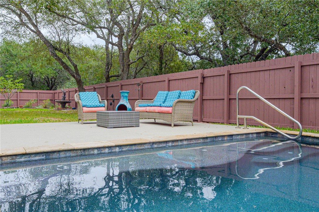 610 Bent Tree Street Rockport, TX 78382 - Photo 11 of 40 a backyard of a house with barbeque oven