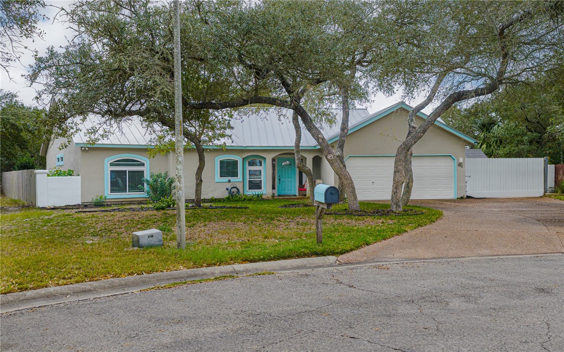 610 Bent Tree Street Rockport, TX 78382 - Photo 2 of 40 a view of a yard in front of a house with a large tree