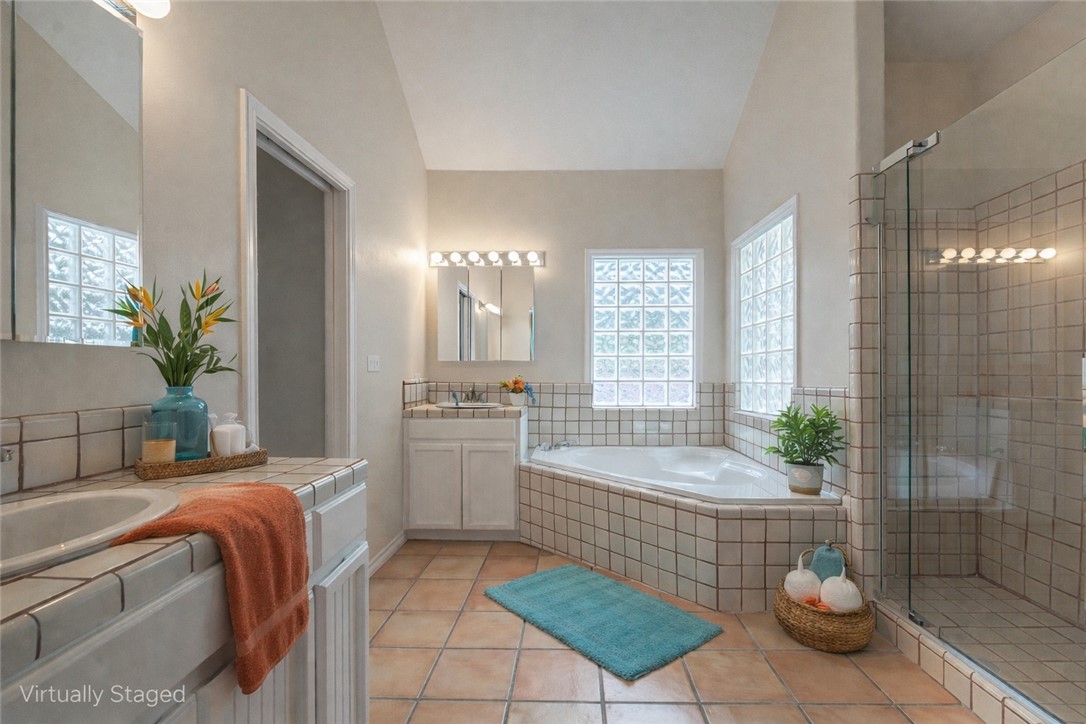 610 Bent Tree Street Rockport, TX 78382 - Photo 29 of 40 a spacious bathroom with a tub shower and sink