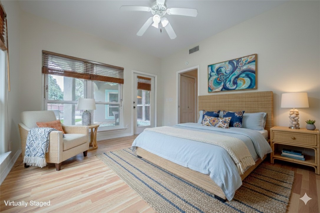 610 Bent Tree Street Rockport, TX 78382 - Photo 33 of 40 a spacious bedroom with a bed and a couch