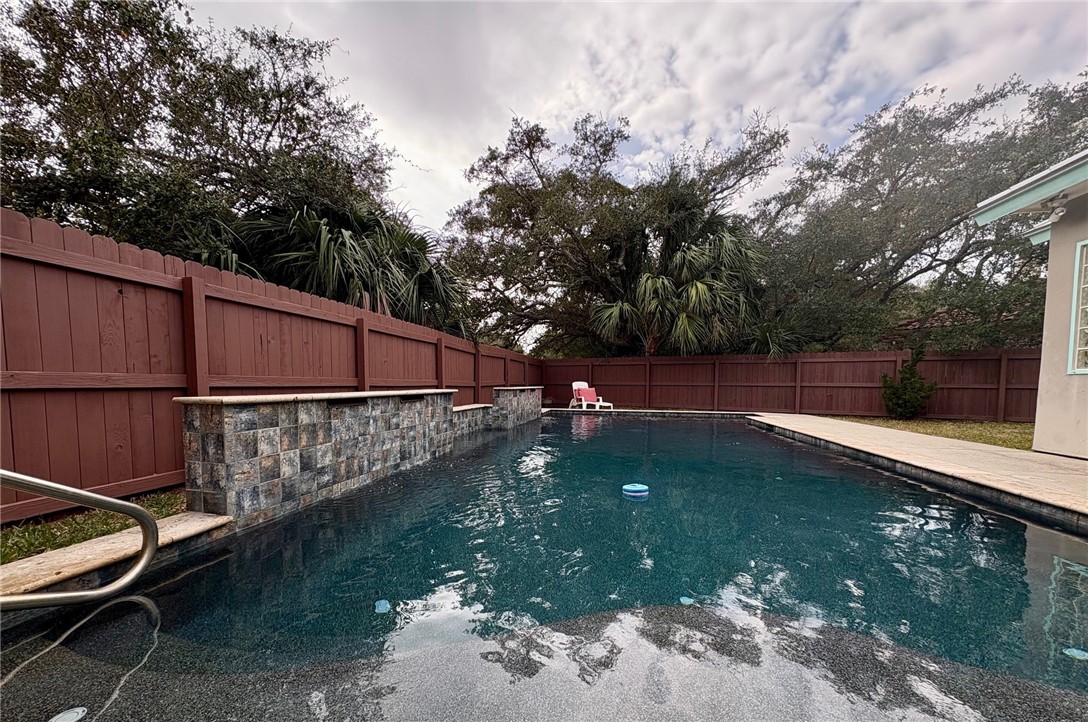 610 Bent Tree Street Rockport, TX 78382 - Photo 39 of 40 a view of a backyard with swimming pool