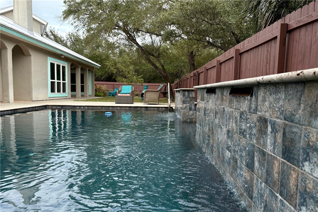 610 Bent Tree Street Rockport, TX 78382 - Photo 40 of 40 a white house that has pool in front of it