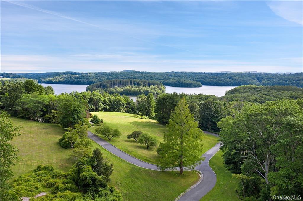 578 Cross River Road Katonah, NY 10536 - Photo 4 of 8 a view of a lake with a mountain in the background