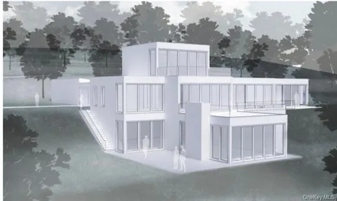 a view of a house with backyard and deck