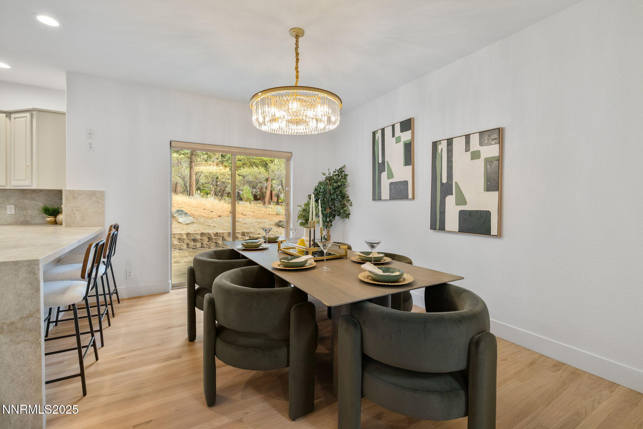 16435 Snow Flower Drive Reno, NV 89511 - Photo 13 of 48 a view of a dining room with furniture and wooden floor