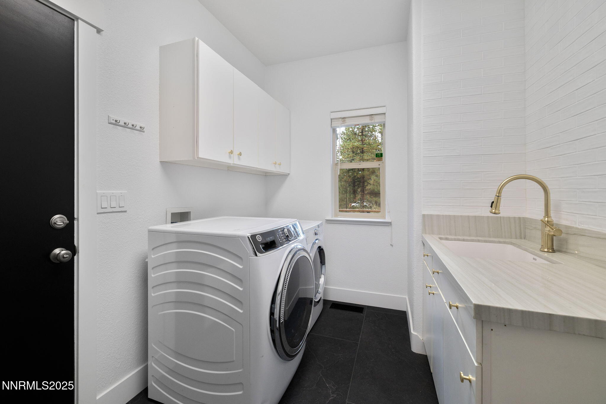 16435 Snow Flower Drive Reno, NV 89511 - Photo 16 of 48 a utility room with a sink a washer and dryer