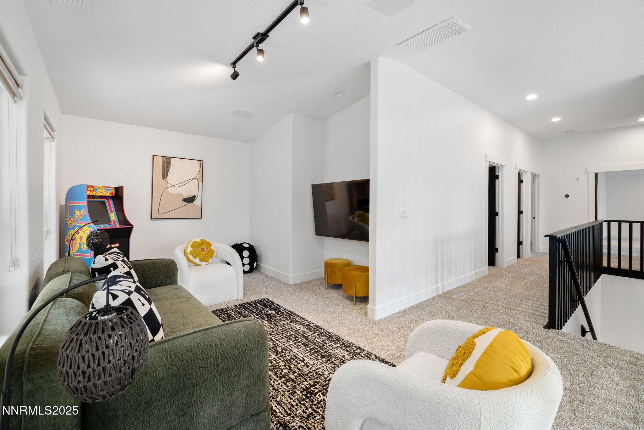 16435 Snow Flower Drive Reno, NV 89511 - Photo 18 of 48 a living room with furniture and a flat screen tv
