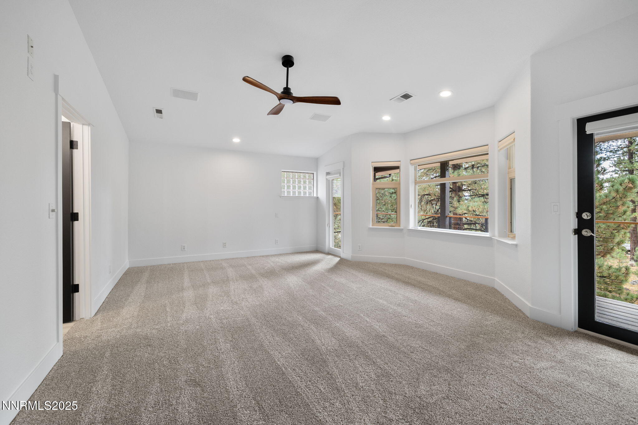 16435 Snow Flower Drive Reno, NV 89511 - Photo 19 of 48 an empty room with windows and ceiling fan