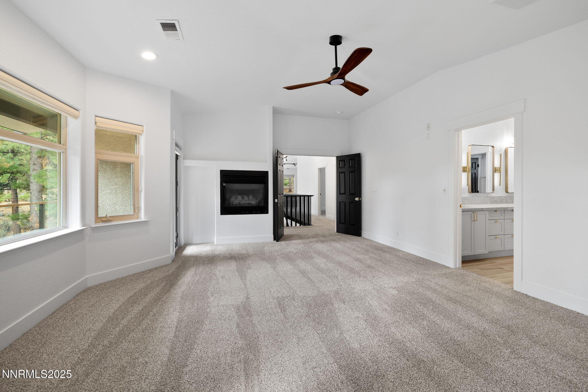 16435 Snow Flower Drive Reno, NV 89511 - Photo 20 of 48 a view of empty room with a fireplace and window