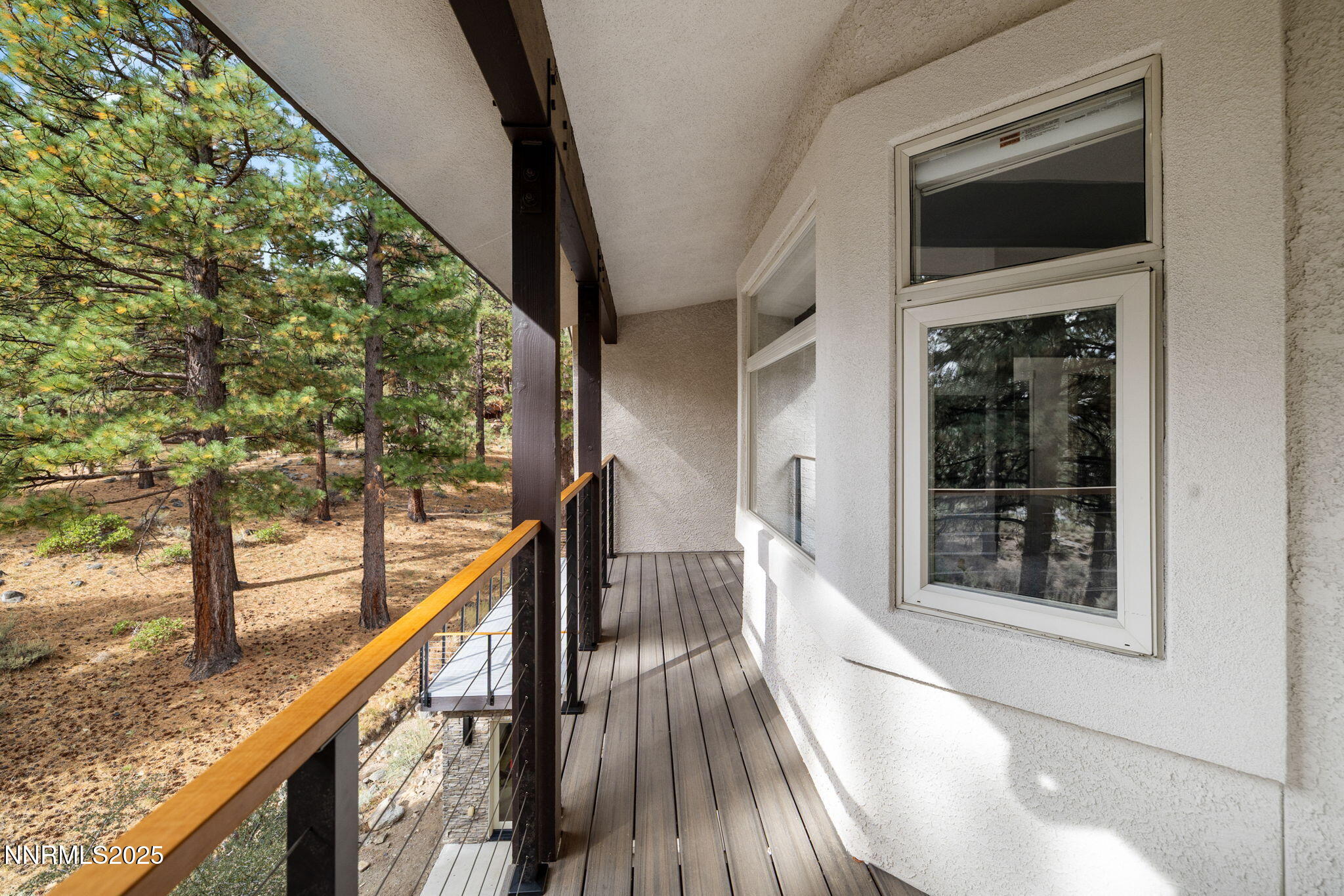 16435 Snow Flower Drive Reno, NV 89511 - Photo 22 of 48 a view of a balcony with wooden floor and fence