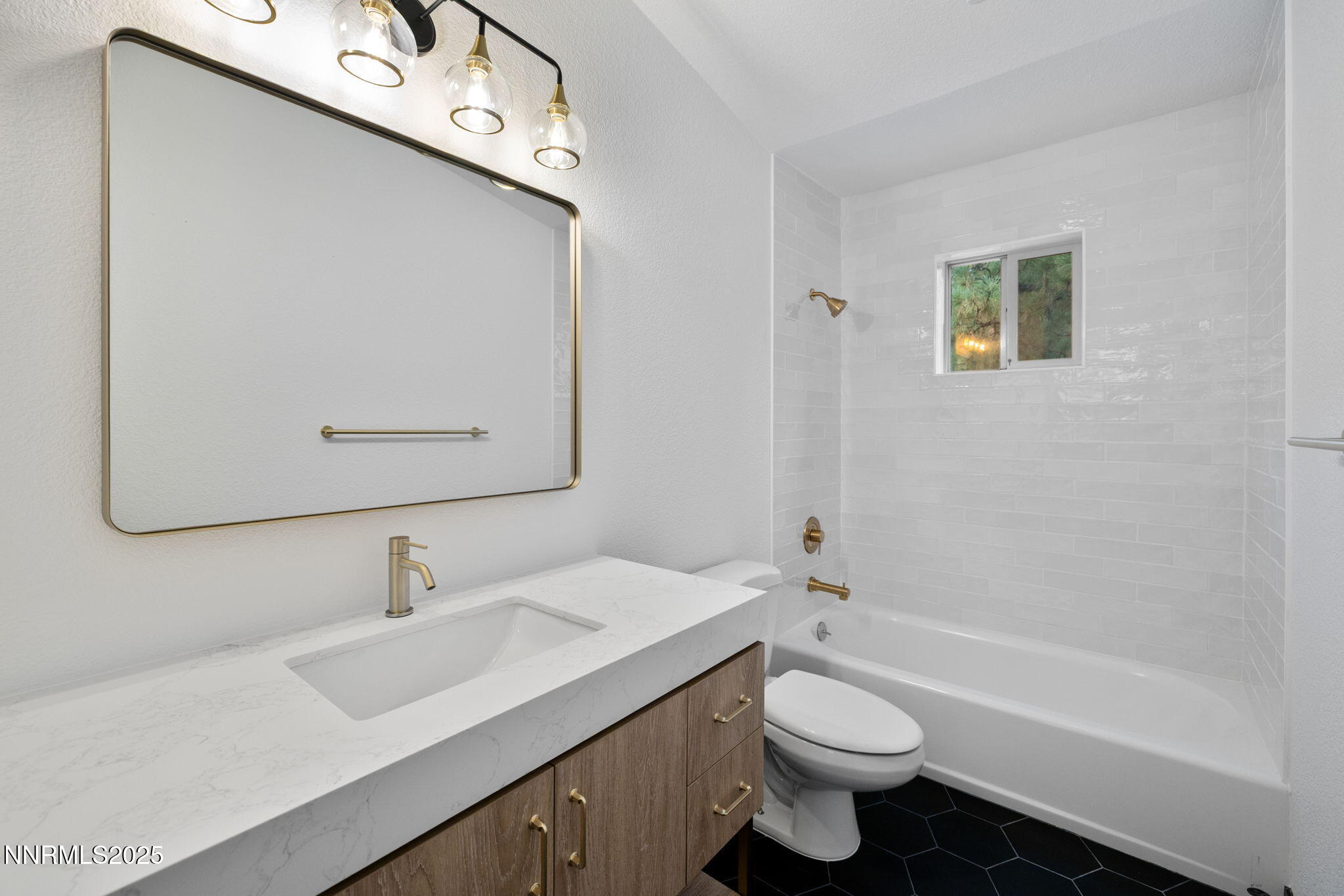 16435 Snow Flower Drive Reno, NV 89511 - Photo 29 of 48 a bathroom with a sink a toilet and shower