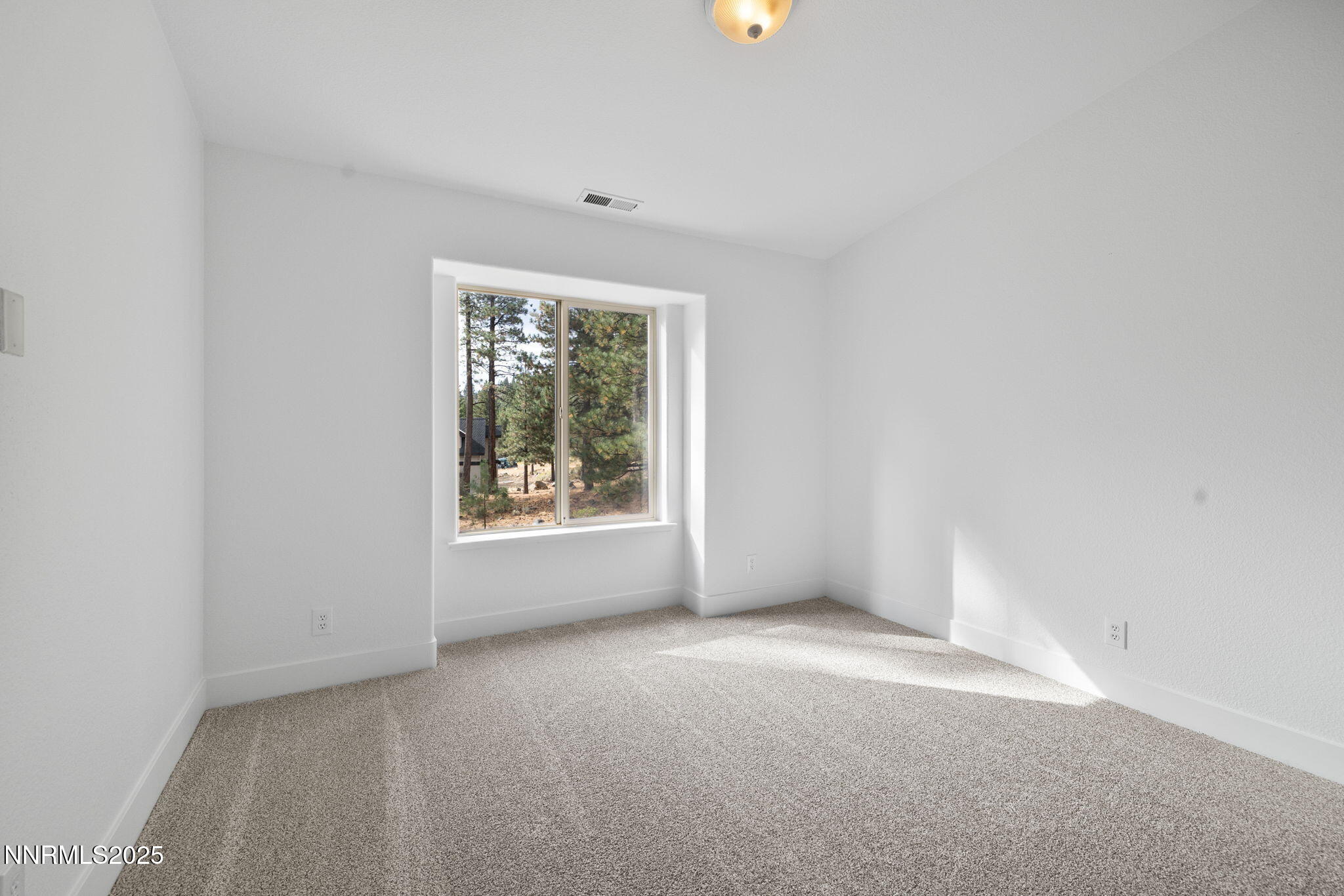 16435 Snow Flower Drive Reno, NV 89511 - Photo 30 of 48 a view of an empty room with a window