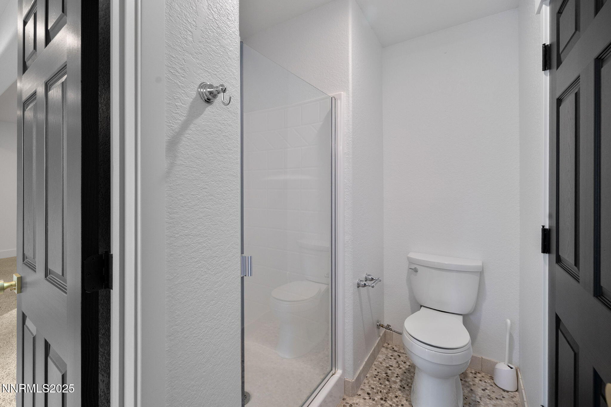 16435 Snow Flower Drive Reno, NV 89511 - Photo 34 of 48 a bathroom with a granite countertop toilet and a shower