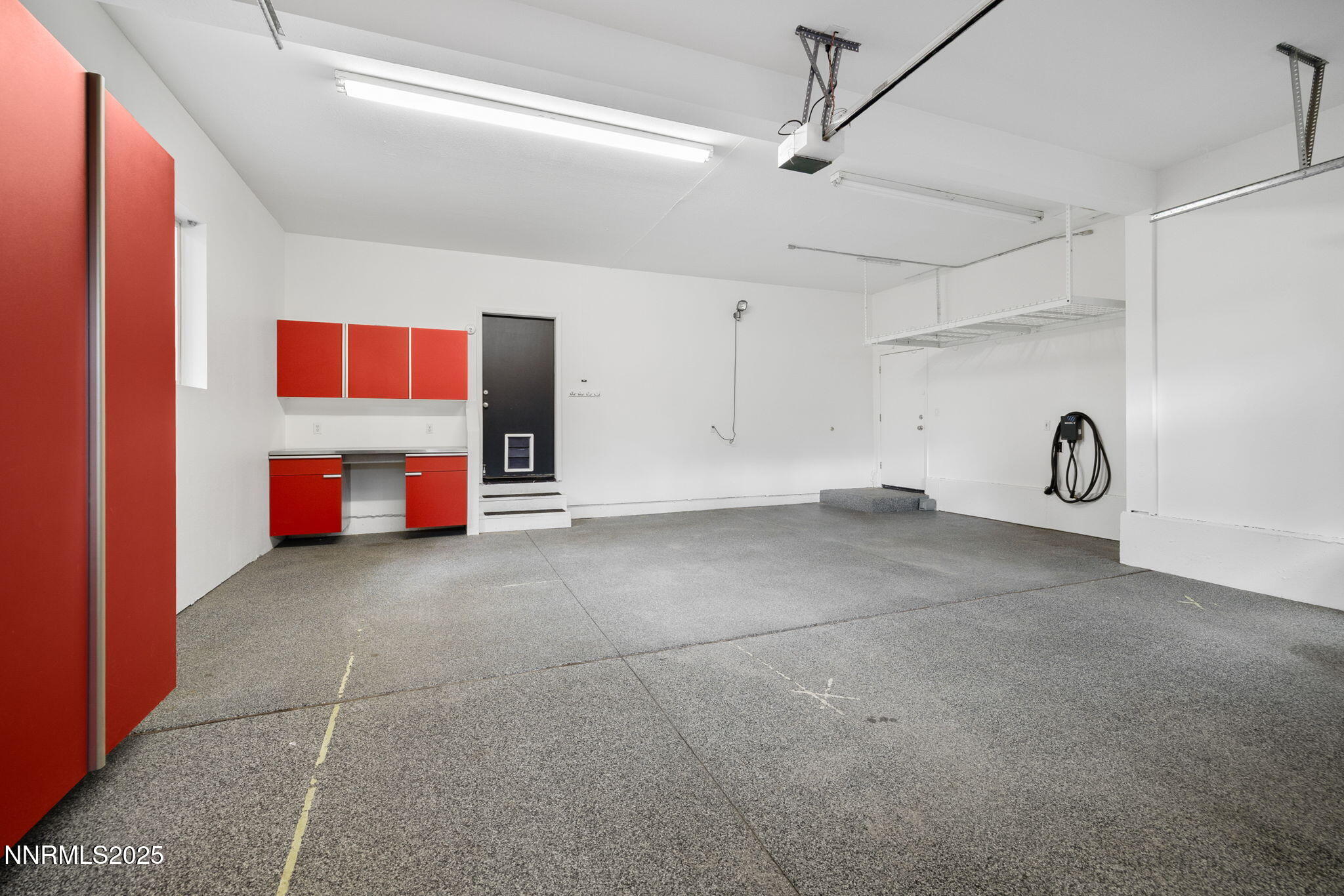 16435 Snow Flower Drive Reno, NV 89511 - Photo 40 of 48 a view of a room with that has a ceiling fan and a rug