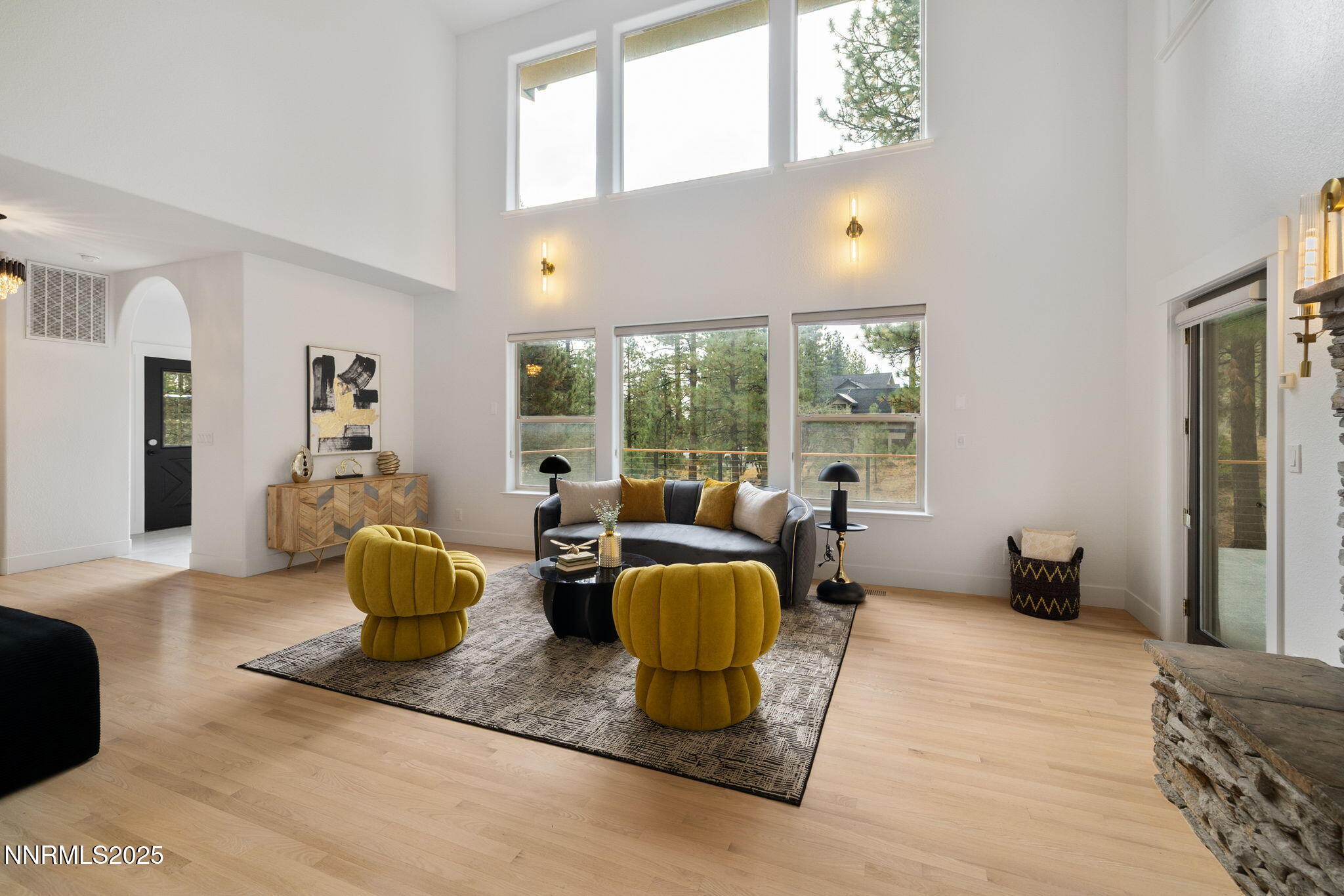 16435 Snow Flower Drive Reno, NV 89511 - Photo 7 of 48 a living room with furniture a large window and wooden floor