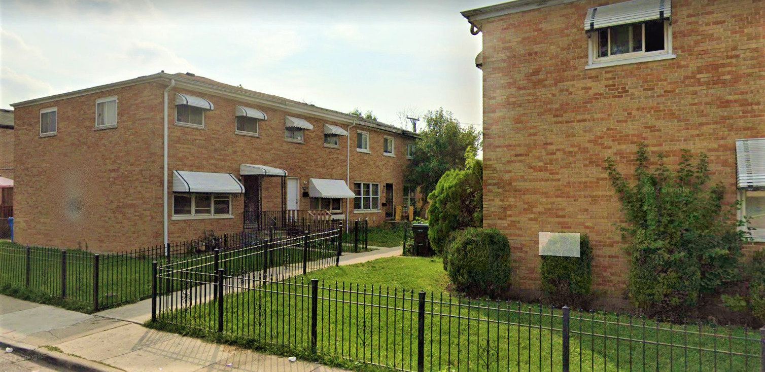 a view of a house with backyard and porch
