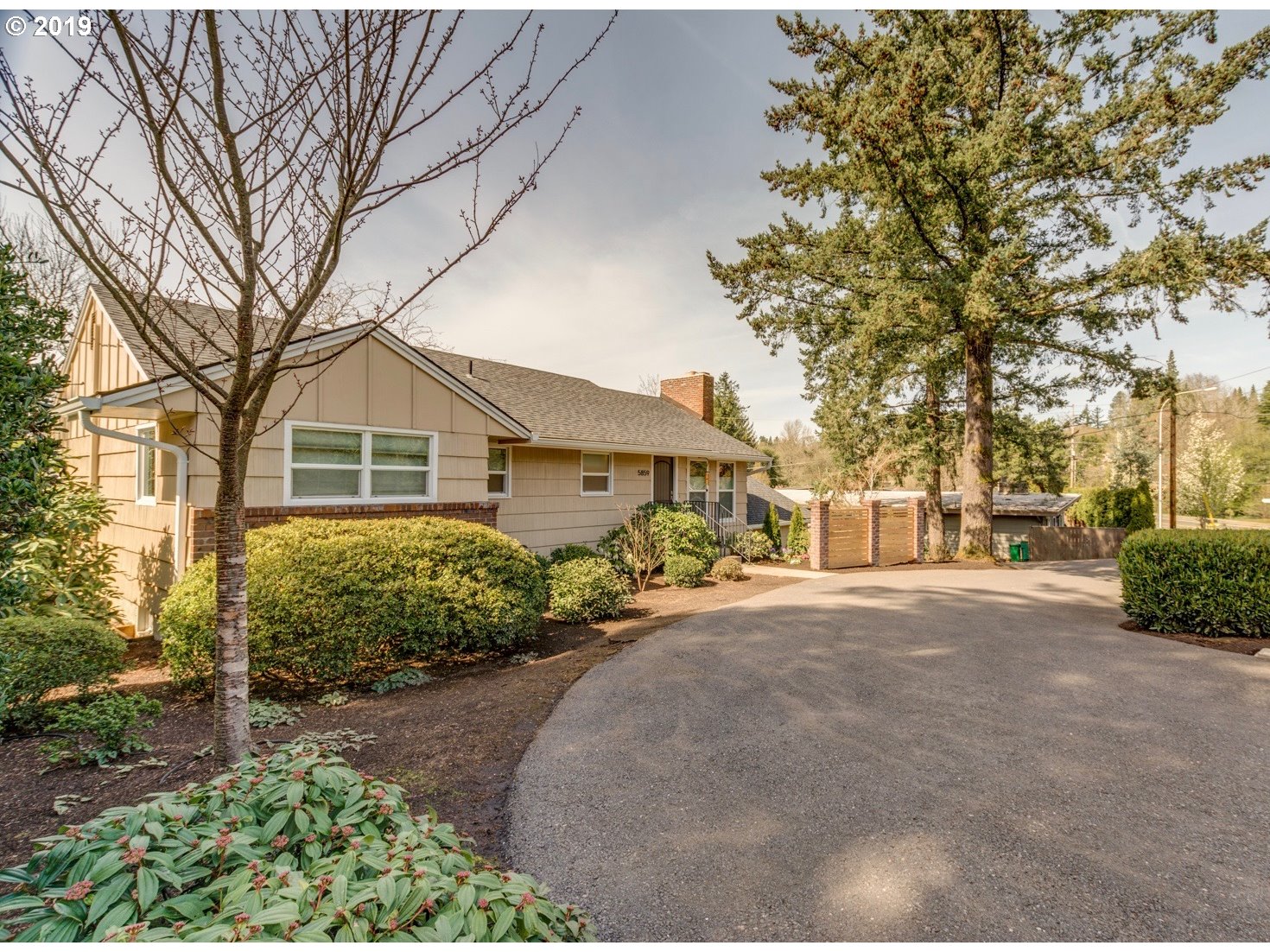 5859 Southwest Oleson Road Portland, OR 97225 - Photo 1 of 32 a front view of a house with garden